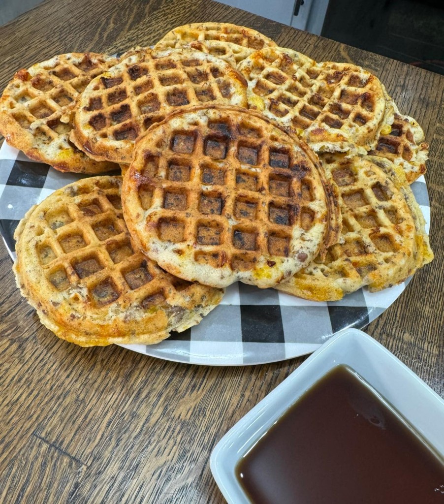 Introduction Get ready to elevate your breakfast game with a dish that’s as indulgent as it is delicious: Sausage and Cheese Waffles. Imagine crispy, golden waffles studded with savory sausage and gooey cheese, served piping hot and drizzled with maple syrup. Whether you’re hosting a brunch gathering or simply treating yourself to a special morning meal, these waffles are guaranteed to impress. Let’s dive into the recipe and discover how to create this mouthwatering masterpiece!  Who Will Love This Recipe? Are you a breakfast aficionado searching for a savory twist on a classic favorite? Or perhaps you’re hosting a brunch and want to wow your guests with a unique and satisfying dish? Look no further than Sausage and Cheese Waffles. This recipe is perfect for anyone who appreciates the comforting combination of hearty sausage, melted cheese, and fluffy waffles.  Why It’s Great What sets these waffles apart is their irresistible combination of flavors and textures. The savory sausage adds a hearty depth of flavor, while the melted cheese lends a gooey richness that perfectly complements the crispiness of the waffle exterior. Plus, they’re incredibly versatile—you can enjoy them for breakfast, brunch, or even dinner!  Ingredients 1 ½ cups all-purpose flour 2 tsp baking powder 1 tsp salt 1 tsp sugar 2 eggs 1 ¼ cups milk 1/3 cup vegetable oil 1 cup cooked breakfast sausage, crumbled 1 cup shredded cheddar cheese Optional toppings: maple syrup, sour cream, chopped chives  For Complete Cooking STEPS Please Head On Over To Next Page Or Open button (>) and don’t forget to SHARE with your Facebook friends