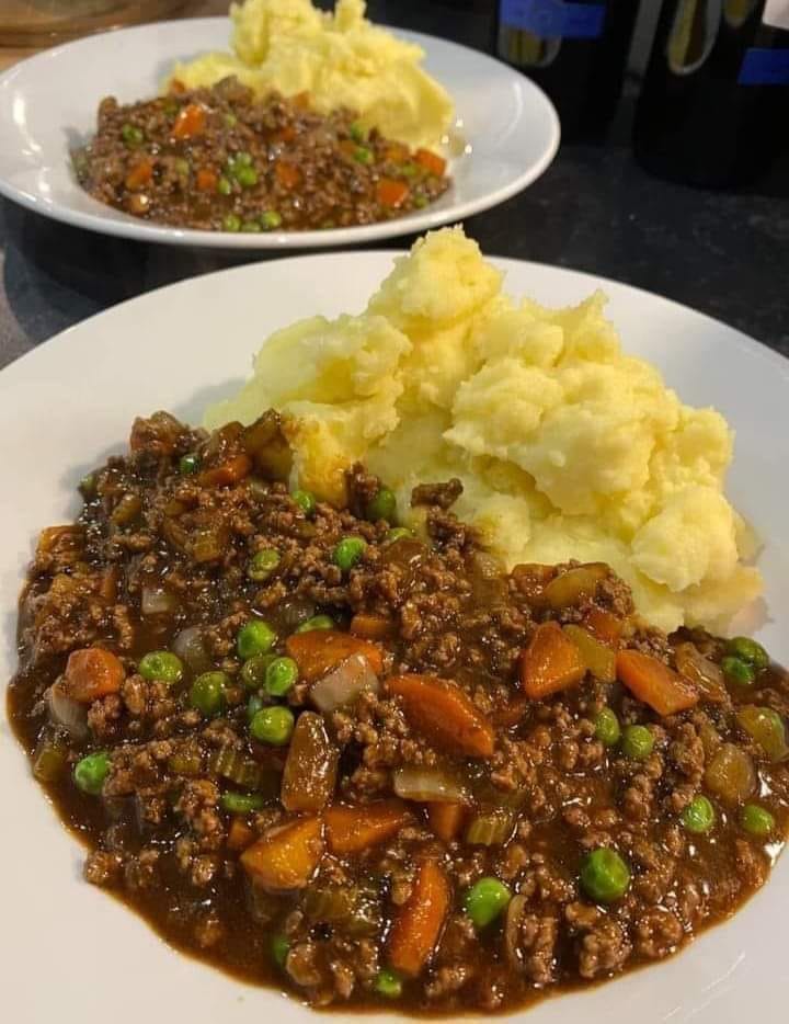 Hearty Mince and Tatties: A Comforting Scottish Classic Indulge in the heartwarming flavors of our Mince and Tatties, a classic Scottish dish that embodies comfort and tradition. This simple yet satisfying meal is sure to become a staple in your recipe repertoire, perfect for cozy family dinners or chilly evenings.  Mince and tatties, short for minced beef and potatoes, is a beloved dish that holds a special place in Scottish culinary heritage. Originating from humble roots, this comforting meal has been enjoyed by generations of Scots, providing nourishment and warmth during cold winters. Its enduring popularity is a testament to its delicious simplicity and ability to bring people together around the dinner table.  For Ingredients And Complete Cooking Instructions Please Head On Over To Next Page Or Open button (>) and don’t forget to SHARE with your Facebook friends