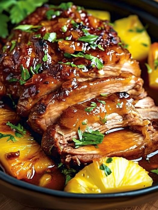 Slow Cooker Pineapple Pork Loin🍍 This Slow Cooker Pineapple Pork Loin is a Sweet and Savory Dream Come True! 🍖 Ingredients: Pork loin: 2-3 lbs, trimmed of excess fat Vegetable oil: 2 tablespoons Salt and pepper: to taste Garlic: 8 cloves, minced Soy sauce: 1/4 cup Brown sugar: 1/2 cup Pineapple chunks with juice: 1 can (23.5 ounces) Instructions: Read more on next page