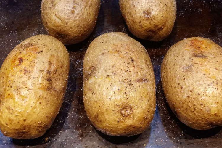 How to Make a Perfect Baked Potato, one that is crispy on the outside, light and fluffy on the inside.