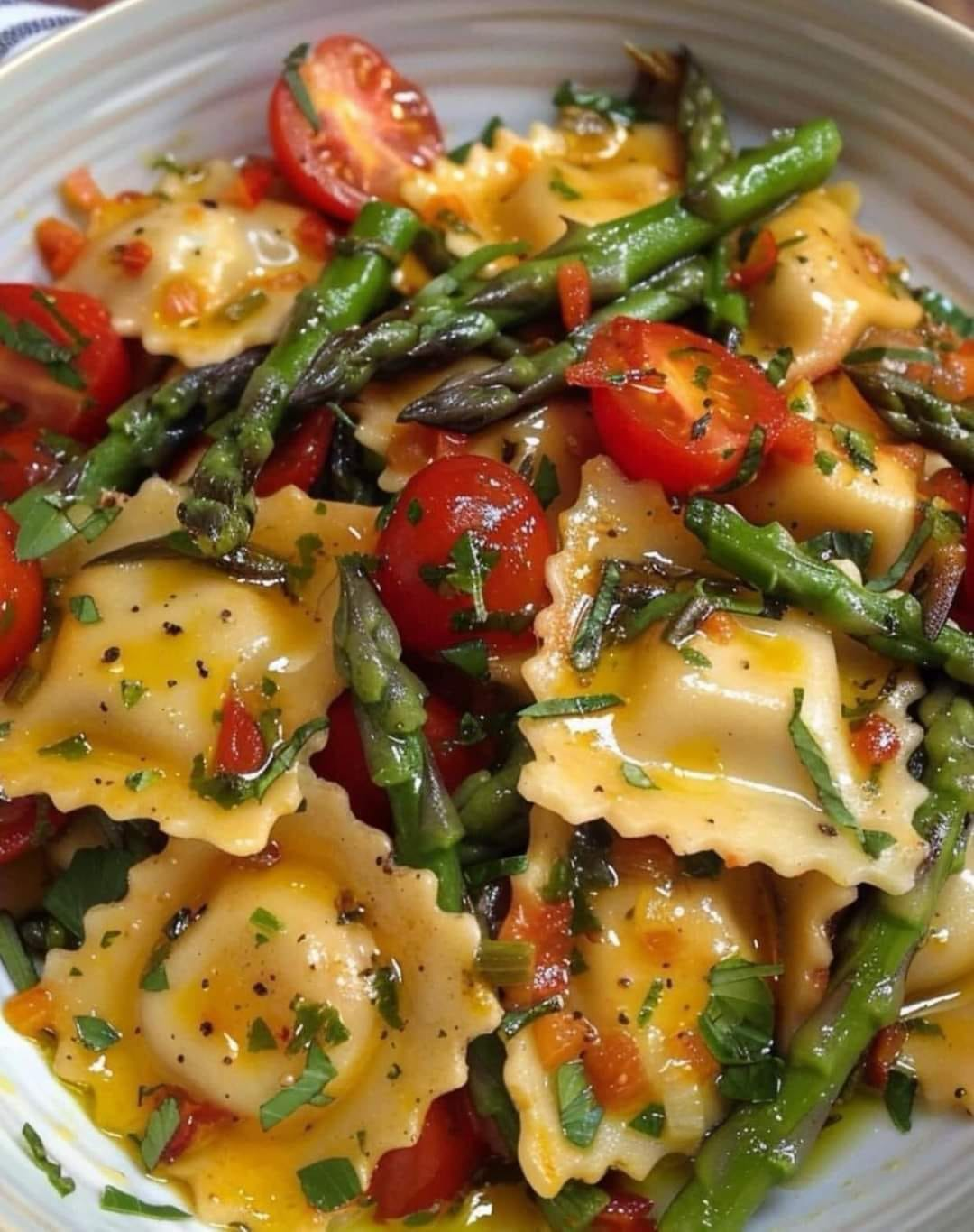 Ravioli with Tomatoes, Asparagus, Garlic, and Herbs